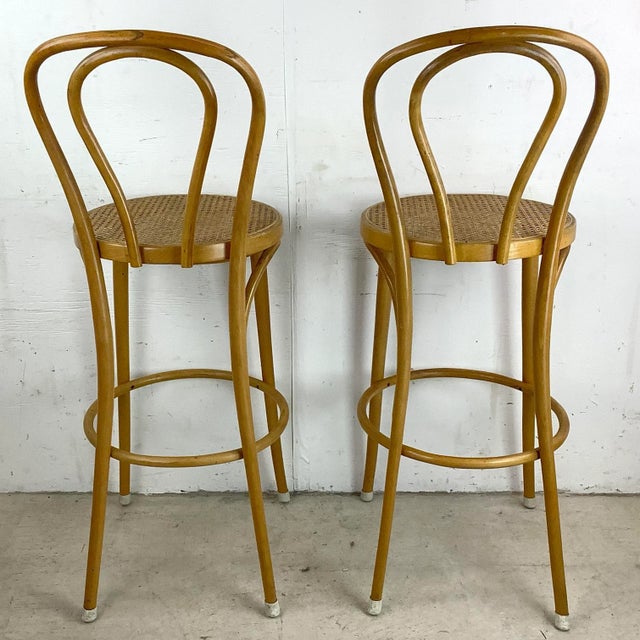 Enhance your home bar with a touch of vintage charm and modern elegance with this Pair of Vintage Modern Cane Seat...