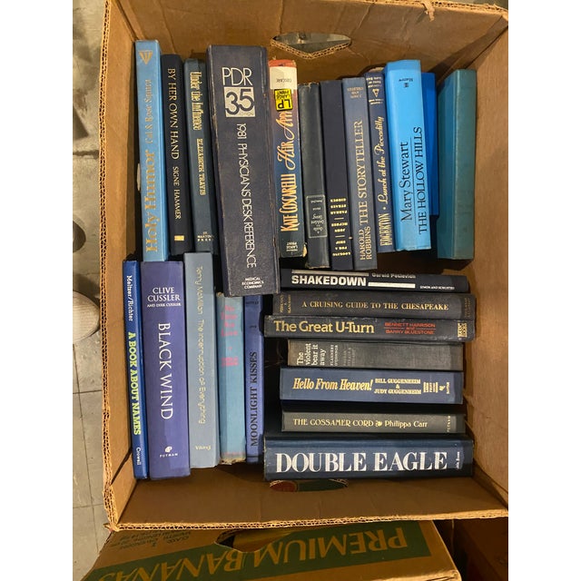 A set of 10 vintage books that range from colors of blue, author, year published that include a variety of literary works....