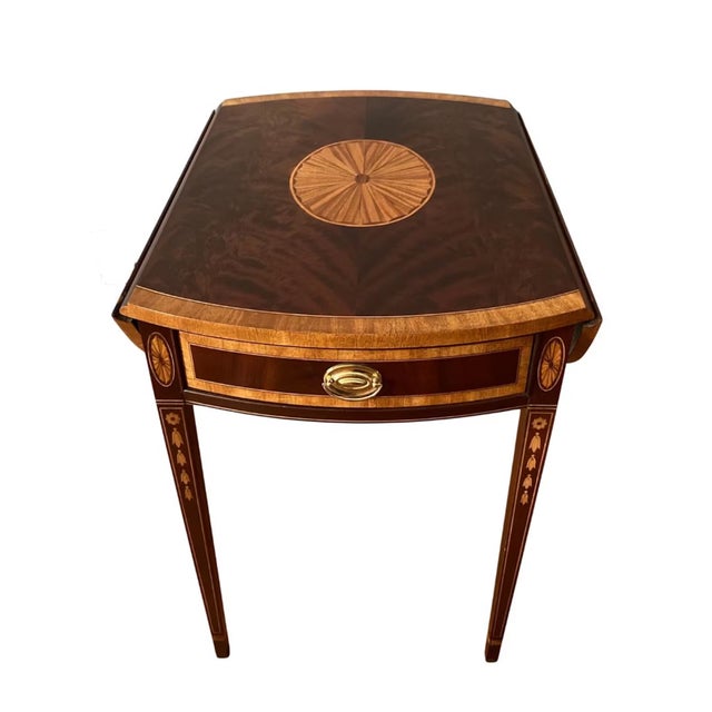 A fine pair of late twentieth century single-drawer Hepplewhite-style Pembroke tables by American furniture maker,...