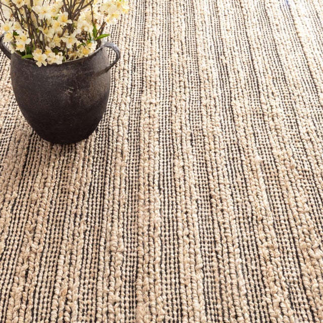 Add subtle safari sophistication to your floor with durable, soft to the touch chenille and jute. A chic tribal inspired...