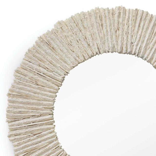 Inspired from natural slate stone, this round mirror brings dimension and texture to any room. Due to the natural...