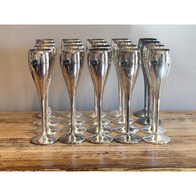 Raise a glass in style with this spectacular, rare estate-sized matching set of 20 vintage silver-plated champagne flutes...