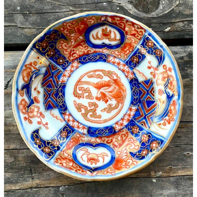 A beautiful antique Japanese Imari porcelain saucer dish dating to the late Meiji period, hand decorated in vibrant cobalt...