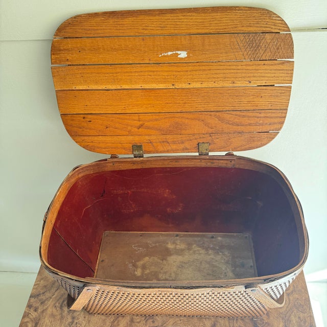 Mid 20th century picnic basket made from wood, wicker, and I believe a leather lining, but im not 100% sure on the leather...