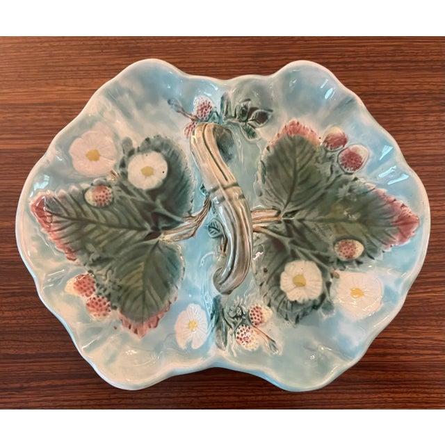 Antique Majolica two section handled serving dish. Beautiful Robin’s Egg Blue painted with green leaves and daises.