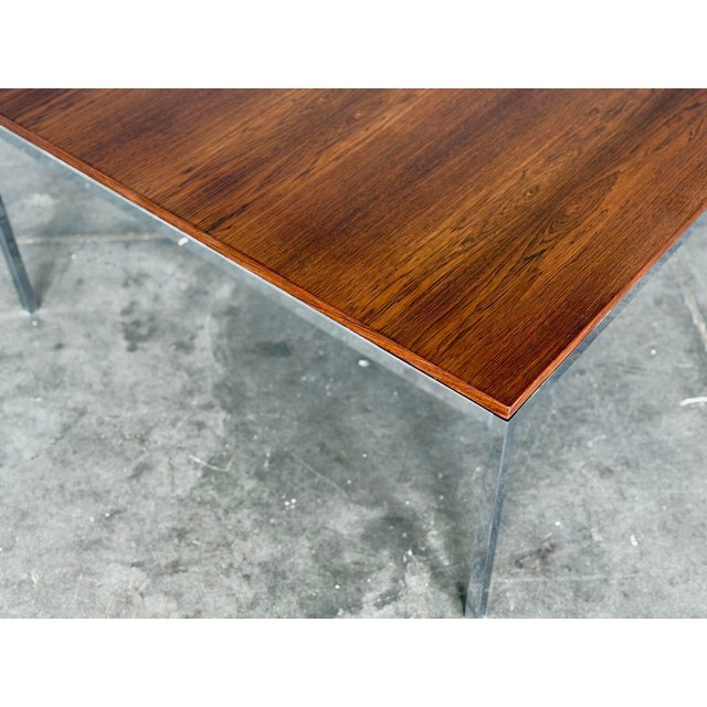 Florence Knoll rosewood and chromed steel cocktail table, circa 1960s. Excellent condition with minor signs of use....