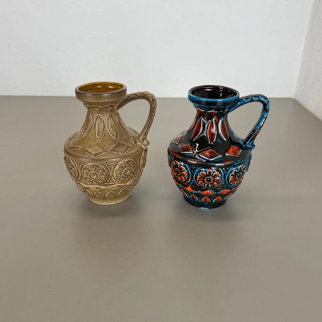Set of 2 original vintage 1960s pottery ceramic vase made in germany. High quality german production with an abstract...
