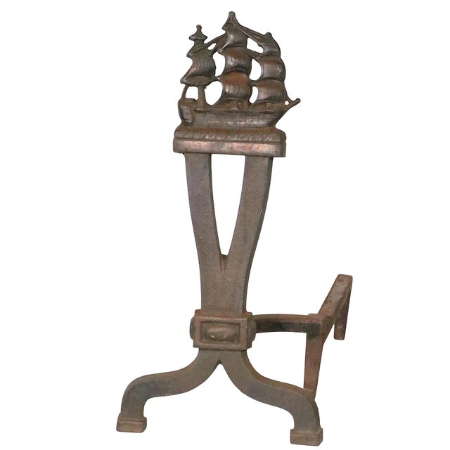 Pair nautical themed cast iron andirons, having a masted sailing ship motif. Circa 1910/30's, one ship is missing the...
