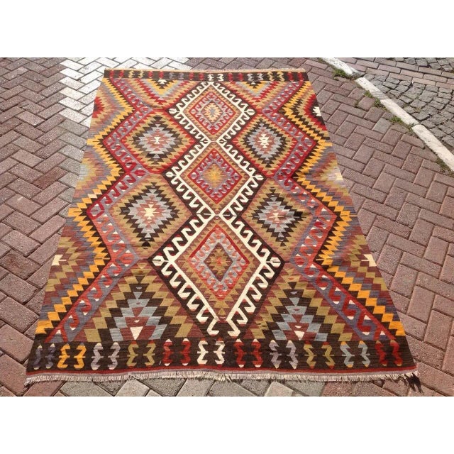 This beautiful, vintage, handwoven kilim is approximately 60 years old. It is handmade of very fine quality wool and...