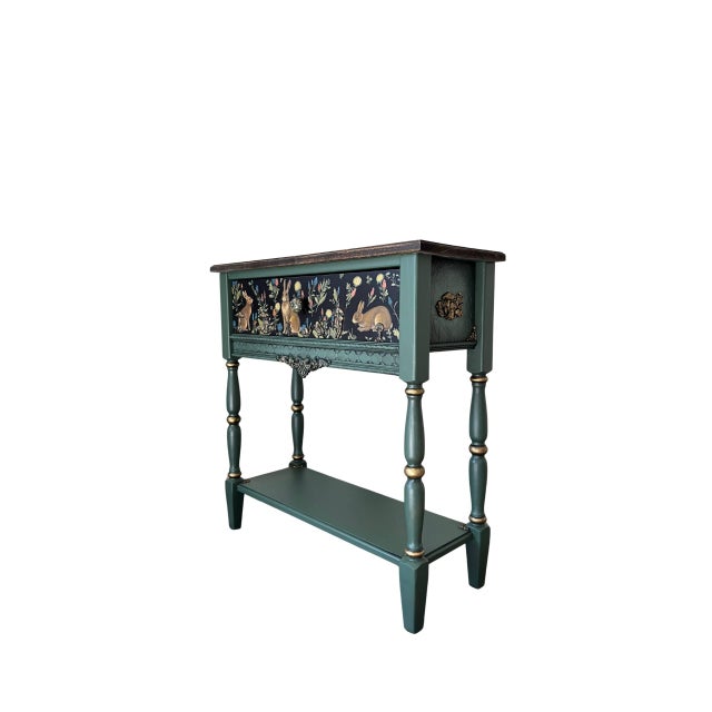 Bring the magic of an enchanted woodland into your home with this one-of-a-kind hand-painted console table, featuring a...