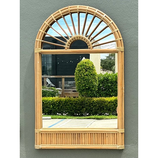 This vintage boho arched wall mirror beautifully captures the relaxed elegance of mid-century coastal design with its...