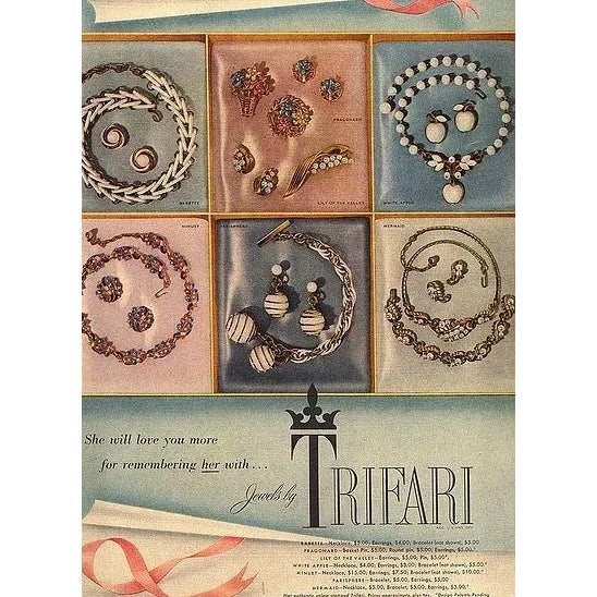 Goldtone and white balls spiral clip back earrings. Marked "Trifari." From Trifari's Parisphere line. Identical earrings...
