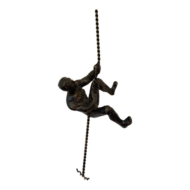Vintage Modernist Cast Metal Hanging Sculpture of a Man Climbing For Sale