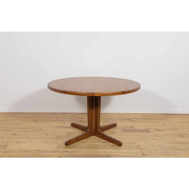 This extending dining table was manufactured in Denmark during the 1960s. The piece is distinguished by its timeless...