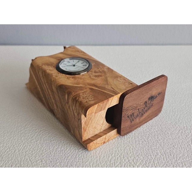 A striking handcrafted desk clock by renowned American master woodworker and author Michael Elkan. Sculpted from a solid...