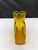A beautiful hand blown glass water bottle by Blenko. The rich amber color is a perfect addition to your kitchen decor....