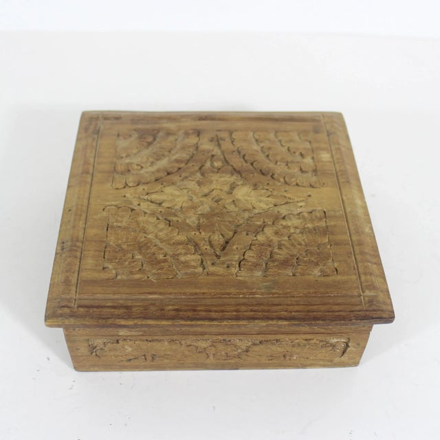 Length: 6 Inches; Width: 6 Inches; Height: 2 Inches Lovely carved wood trinket box. The hinged lid opens easily. Good size...