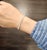 A modern tennis bracelet crafted in 14k white gold, featuring 7.42 carats of natural 50 round white diamonds, graded G/H...