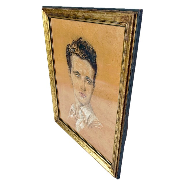 Vintage portrait of a young man pastel drawing. Depicts a hand drawing of a handsome wavy haired young man on pastel paper...