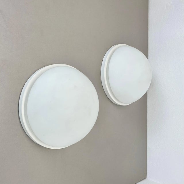 Article: set of two wall lights or ceiling lights Producer: Glashütte Limburg, Germany Origin: Germany Age: 1980s Original...