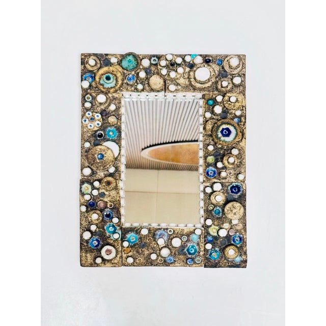 This extraordinary studio ceramic mirror was created around 1970 in Germany and combines ceramic sculpture with functional...