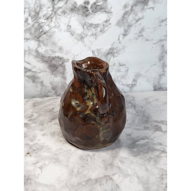 This antique Turkish pottery jug has the perfect color glaze and patina. It is primitive in its handcrafted beginnings and...