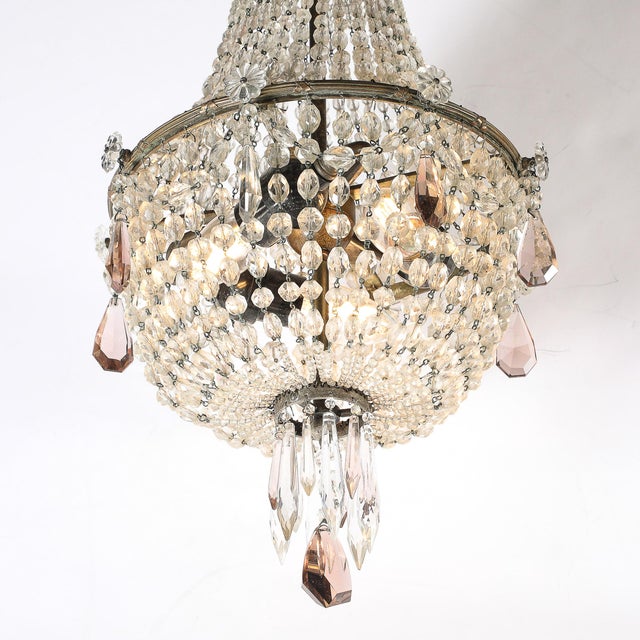 This exquisite Hollywood Regency chandelier, attributed to the iconic French crystal maker Baccarat, is a luxurious...