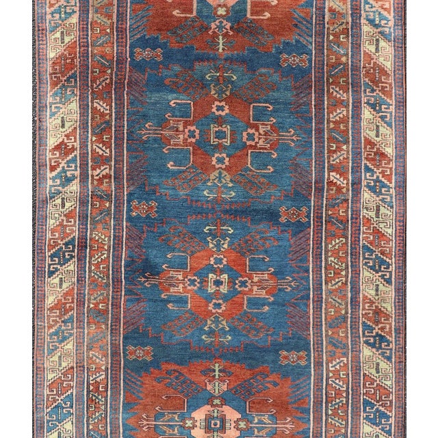 Measures: 4'4 x 8'9 Antique Persian Kurdish Gallery Rug with Blue Field and Bold Geometric Medallion. Keivan Woven Arts/...