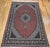 This vintage Persian Tabriz Mahi rug, crafted in the third quarter of the 1900s, beautifully showcases the timeless...