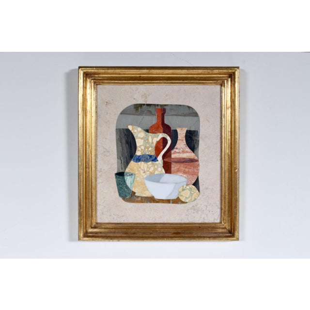 Florentine G. Ugolini Gilt framed still life hand cut natural stone and marble mosaic wall hanging. Featuring a handmade...