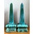 This pair of obelisks presents a classic architectural silhouette, each tall, four-sided shaft tapering gradually from a...