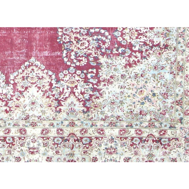 1960s Persian Kerman Carpet. Hand woven in the Kerman region of Iran. Distressed and refinished in the U.S. The Persian...