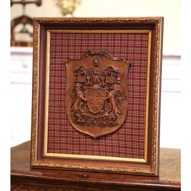 Rich in heraldic symbolism and finely rendered detail, this antique wall plaque features the Royal Coat of Arms of Canada....