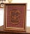 Rich in heraldic symbolism and finely rendered detail, this antique wall plaque features the Royal Coat of Arms of Canada....