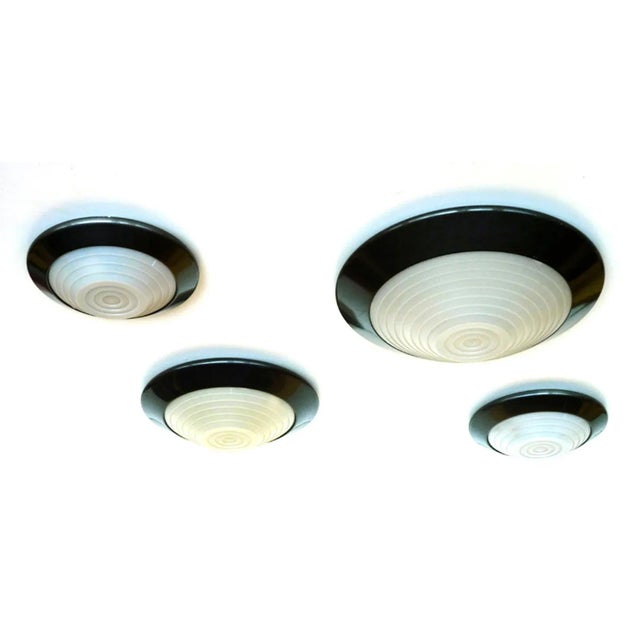 These ceiling lamps from the 1980s or 1990s feature a frame in painted metal and a diffuser in plastic. The lamps have...