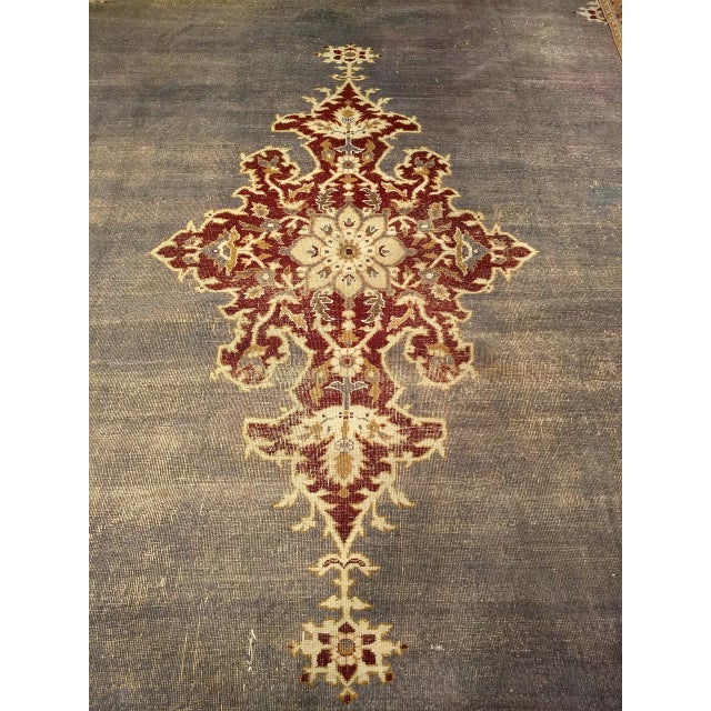 Antique Indian Amritsar from the last quarter of the 1900s with an open field and a central medallion. The Amritsar rug...