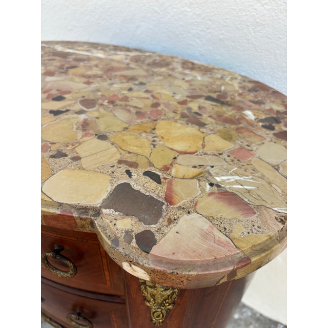 Antique French Louis XV or Louis XVI style kidney-shaped marquetry commode / side table with a marble top. Excellent...