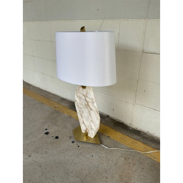Modern Revelation Pentagonal Italian Marble Lamp. Odd shape marble body, gold hardware, white oval shade. Original Retail...