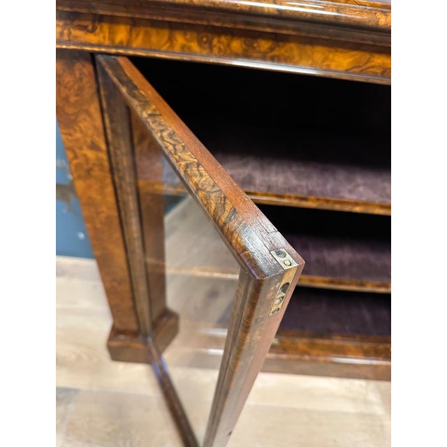 Beautiful small 2-door bookcase/display case in walnut. Completely in original condition. The shelves are also finished in...