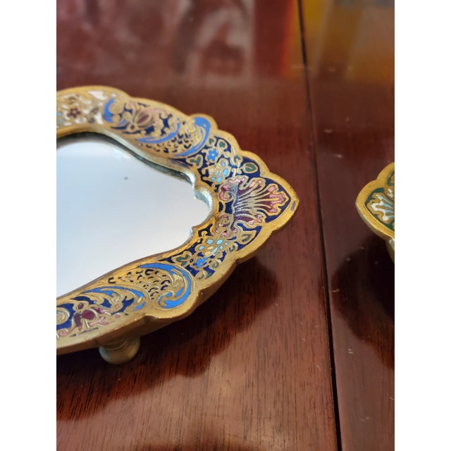 A very fine and rare pair of antique French bronze champleve mirrors decorative objects of vertu. Detailed polychrome...