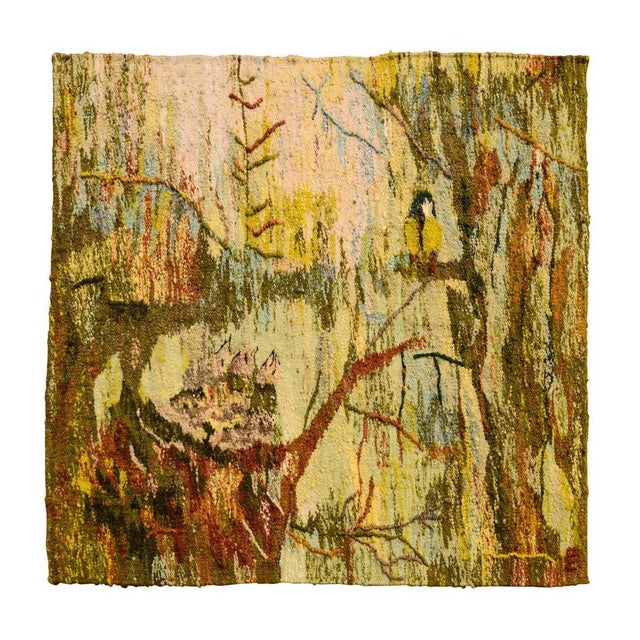 A Mid-Century hand woven wool tapestry with bird on a tree. The tapestry was made in Poland, as documented in the attached...