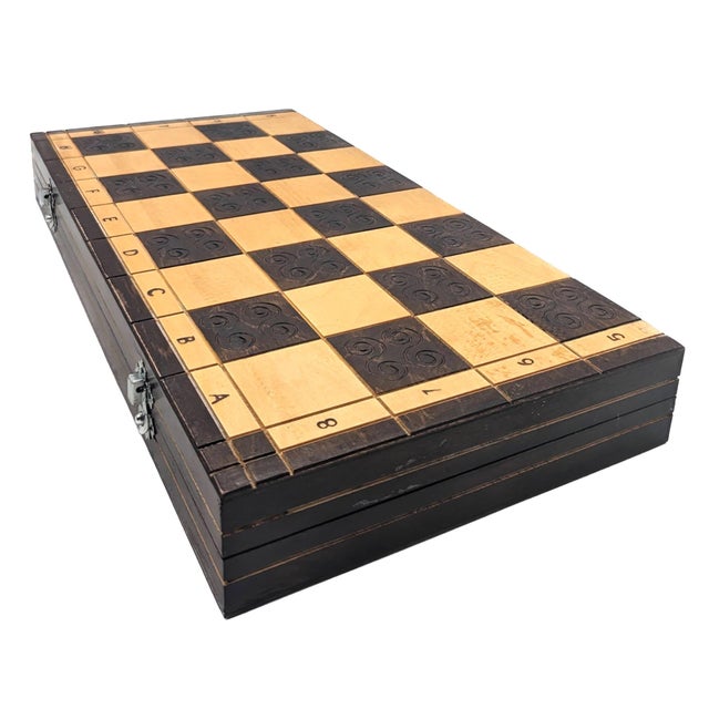 Offered is a circa. mid 1970s, early 1980s carved wood chess set made in Poland, consisting of a two-toned, lacquered...