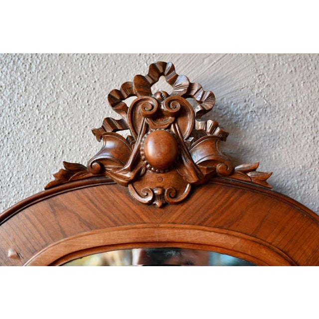 Beveled mirror imbued with delicacy and poetry. The frame is wide, with beautiful craftsmanship that highlights the wood....