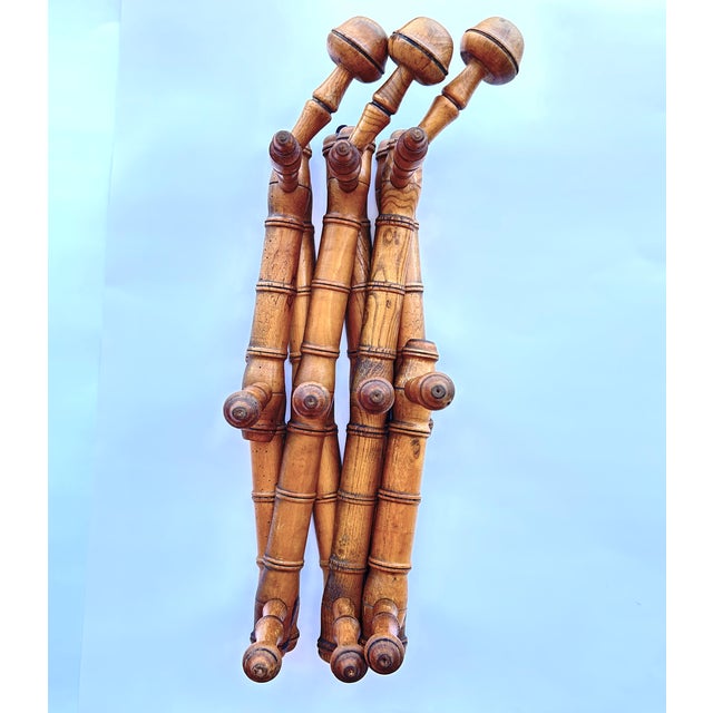1920s French Wood Faux Bamboo Accordion Hat & Coat Rack. Turned by hand it features 3 elongated hat hooks and 7 coat pegs,...