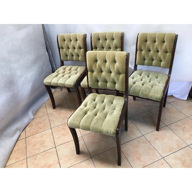 Vintage Design Set of 4 mahogany Chesterfield dining chairs. Olive green with mahogany frames. The frames are made of...