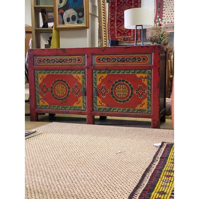 Wonderful solid and well built vintage Chinese console. Very nice paint detail and aging. Two drawers with one shelf...