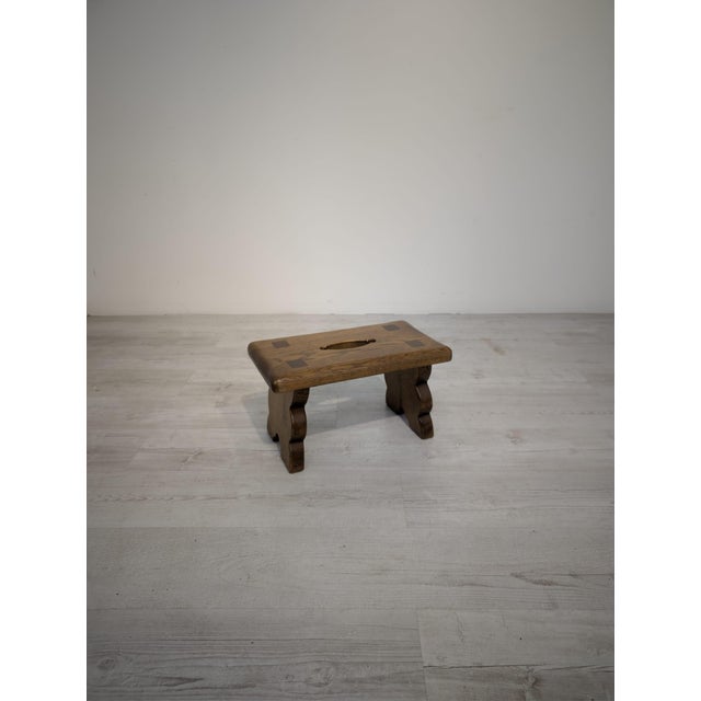 A sturdy and attractive wooden stool in a rustic style. Crafted from solid wood with beautifully visible natural grain and...