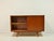This original sideboard from the 1960s combines functional design with the warm elegance of the mid-century modern style....