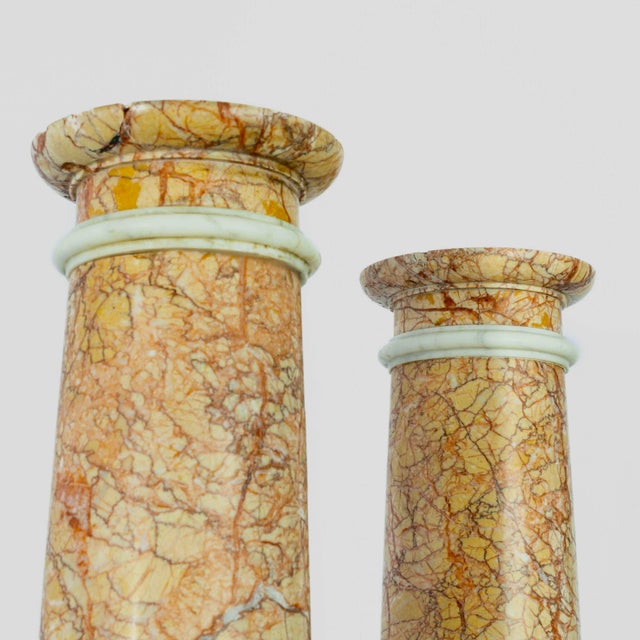 A handsome pair of antique Italian marble columns. Of slender, smaller proportions, crafted in a warm rouge marble alive...
