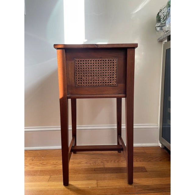 Beautiful classic style and lines. Walnut frame with cane insert sides. Removable top and fully lined on both layers.